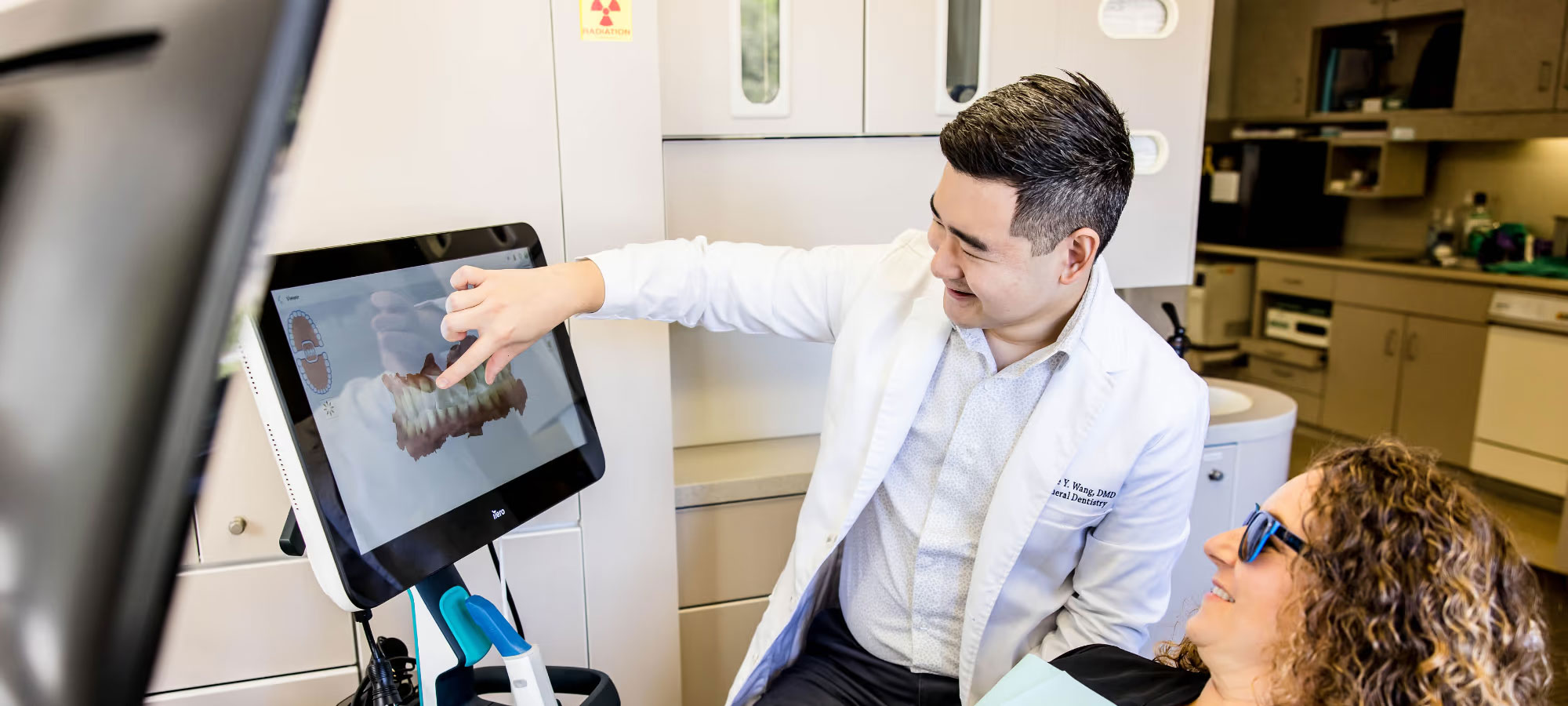 The image shows a hand holding a tablet with a star rating graphic on the screen, indicating high customer satisfaction or approval.